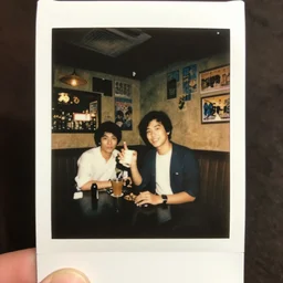 a polaroid photograph taken by nobuyoshi araki of a karaoke bar in tokyo 1 9 7 8