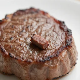 close up of a very tiny steak, food photography
