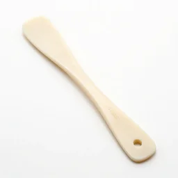 ivory spatula, 8k product photo, isolated on a pure white background, centered, entire object in frame, sharp focus, soft studio lighting
