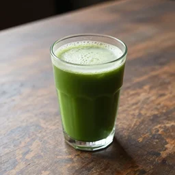 green drink in a glass on an old table