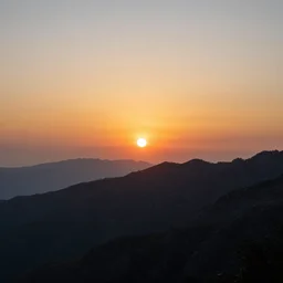 a sunset on a mountain