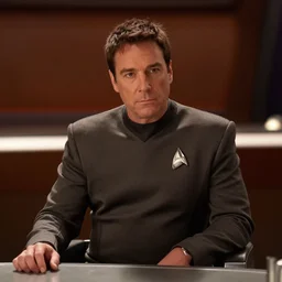 A film still of Bob Odenkirk in a Star Trek: The Next Generation, sitting in Ten Forward, dramatic lighting