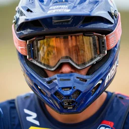 a closeup portrait of a motocross biker, extreme realistic image, hyperrealistic