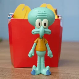photograph of a handsome squidward mcdonalds happy meal toy