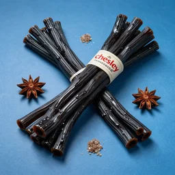 bundle of black licorice on a blue background, long strands of shiny candy, twizzlers, chewable, sugar, anise, fennel, aromatic, chesley bonestell, vincent di fate