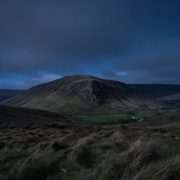 beautiful nocturnal view of a welsh hillly landscape sculpted from fluttering gusts of wind