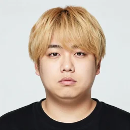 portrait of a young chubby japanese man with blond bangs and a round face