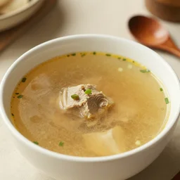 photograph of a bowl of soup made from fabric, photo-realistic, depth of field