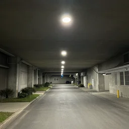 a suburban street with a ceiling, ceiling lights, inside a warehouse, underground