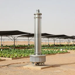 torus shaped electrostatic water condensation collector tower, irrigation system in the background, vertical vegetable gardens under shadecloth and hexagonal frames,  in the middle of the desert, XF IQ4, 150MP, 50mm, F1.4, ISO 200, 1/160s, natural light
