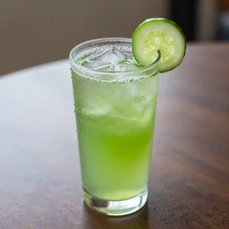 a cucumber drink on a table, water beads
