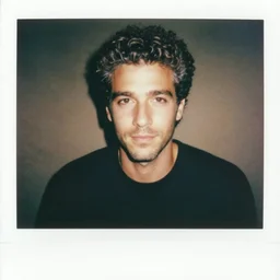 1 9 9 0 s tv, the handsome 4 0 year old man, curly short dark and grey hair, stubble, mtv days, super cool polaroid photography, vhs
