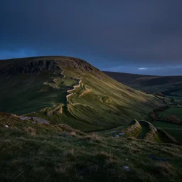 beautiful nocturnal view of a welsh hillside sculpted from wind