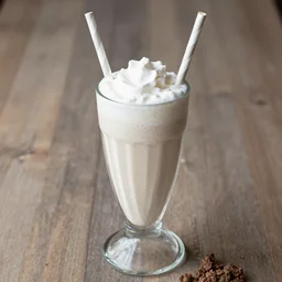 dslr food photograph of a ground beef milkshake in a glass with a striped straw, 8 5 mm f 1. 8
