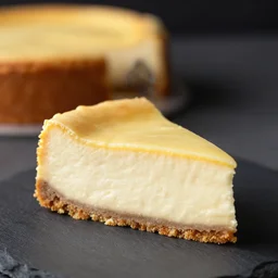 a piece of cheese cake from a high class bakery, depth of field, dark setup, dynamic lighting, food photography, isometric, tasty, wide shot, studio, bokeh, gmaster, cooking, food, kodak, sony, canon