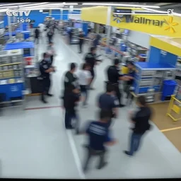cctv footage gang fight in walmart, high angle security camera feed, blurry and glitchy,
