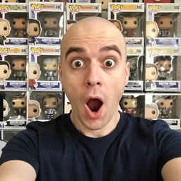 a surprised open mouthed nerdy balding guy surprised in front of his collection of funko pop, happy big open mouth, realistic, selfie