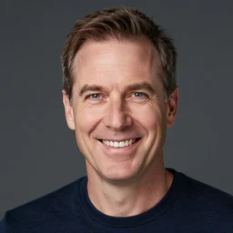 photo of an white man in his 5 0 s, smiling at the camera