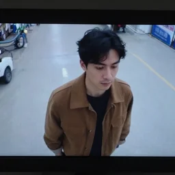 security camera footage, man in brown clothing,
