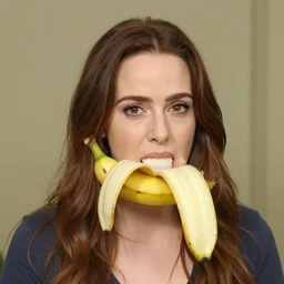 a banana is wearing an emma stone head