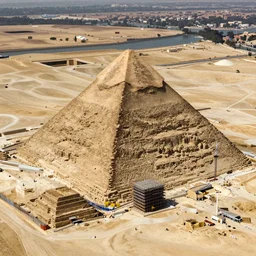 an aerial photograph of future prospective site for a pyramid at giza with the early stages of construction and heavy scaffolding clearly visible, dslr