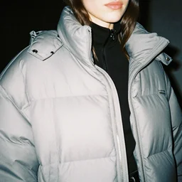 realistic photoshooting for a new acne studio lookbook, color film photography, close up, model is wearing a puffer jacket, photo of a woman, photo in style of tyler mitchell, 3 5 mm, vetements, balenciaga, commes des garcon