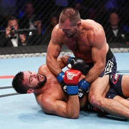 amanda nunes behind dana white giving him a right arm choke, dana white is losing consciousness
