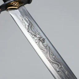 close up view of a sword with dragon etching along the metal blade
