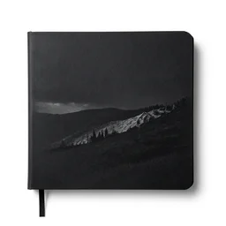 matte black sketchbook, photorealistic, isolated on a pure white background, centered, entire object in frame, sharp focus, soft studio lighting