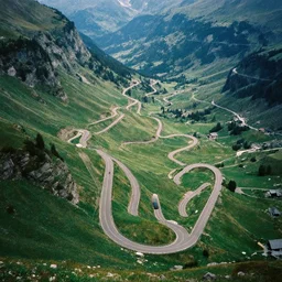 symmetry!! a 2 8 mm macro aerial view of a beautiful winding mountain road in europe, photography, film, film grain, canon 5 0 mm, cinematic lighting