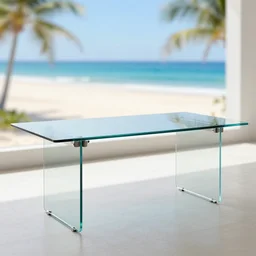 beautiful cool modern glass office table with a blurred beautiful sunny beach view in the background