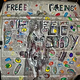 photograph of creepy van at night with free candy written on it