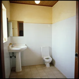a long - shot, color home photograph portrait of a africa bathroom, floor, ceiling, day lighting, 1 9 9 0 photo from photograph magazine.