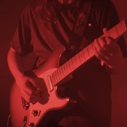 incredibly red hazy dreamy ethereal close - up of a hand strumming an electric guitar, shoegaze, album art