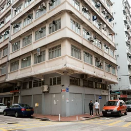 a portrait of a hong kong apartment viewed from the street corner, in the style of carne griffiths, messy