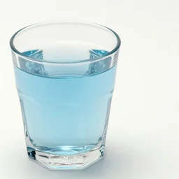 1980s magazine photo of a hexagonal glass of pale blue liquid, next to a window with dappled natural light, smoky