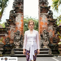 emma watson wearing kebaya bali in bali. iconic place in bali. front view. instagram holiday photo shoot, 3 5 mm