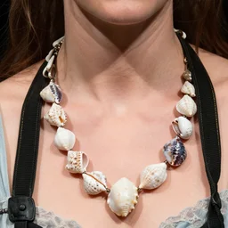 a photograph of Keira Knightley with necklace made of seashells from the stage production of The Tempest taken with Nikon D3500, 4K UHD, high detail, photo realistic