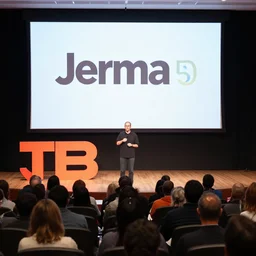 jerma 9 8 5 doing a ted talk, wide shot, high resolution, editorial
