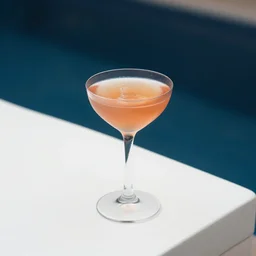 5 5 mm photo of best long cocktail on a zen minimalist white table with dark blue pool in the background. highly detailed 8 k. intricate. lifelike. soft light,