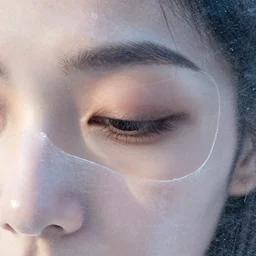 see through clear sheet of ice in front of face behind ice 80mm eye close up