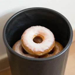 an trash can full with donut inside