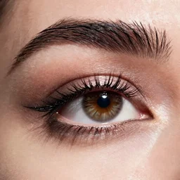 high - end cosmetic photography of close up of eyes with sprinkles mascara