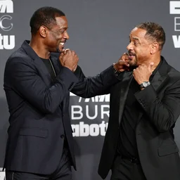 Chris Rock punching Will Smith in the face