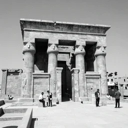a black and white hd photograph of the Temple of Isis view from the outside, few men are in front of the building