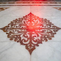 an ornate pattern is defined by the reflection of red light on a white marble floor