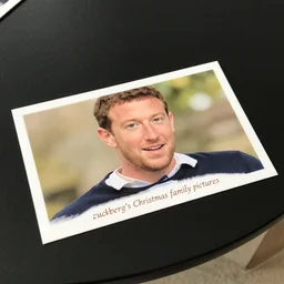 postcard showing 'zuckerberg's christmas family pictures' laying on coffee table, zoomed out, HD, iphone capture