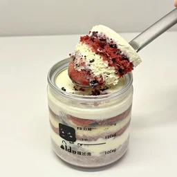 a jar with a birthday cake in it.