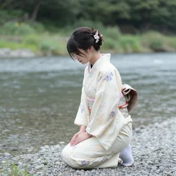 a woman in a kimono kneels on a riverbank