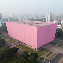 aerial photo of a parametric architecture museum, facade in faded pink fabric, in sao paulo, morning fog, wide camera angle